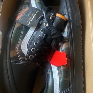 Black and camo low top vans